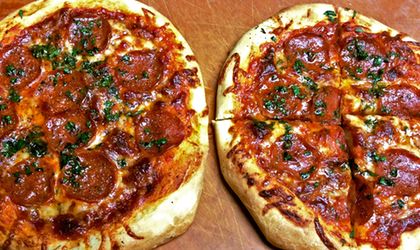 Two beautiful pizzas